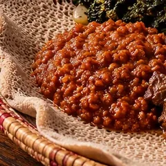 Misir Wot, red lentil stew, on injera