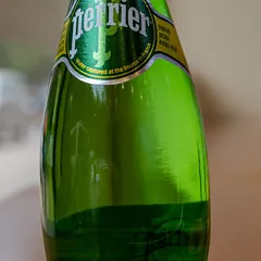 A green bottle of Perrier sparkling water