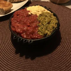 Special Kitfo with ayib and gomen in a bowl