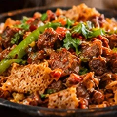 Tibs Firfir with injera and green peppers